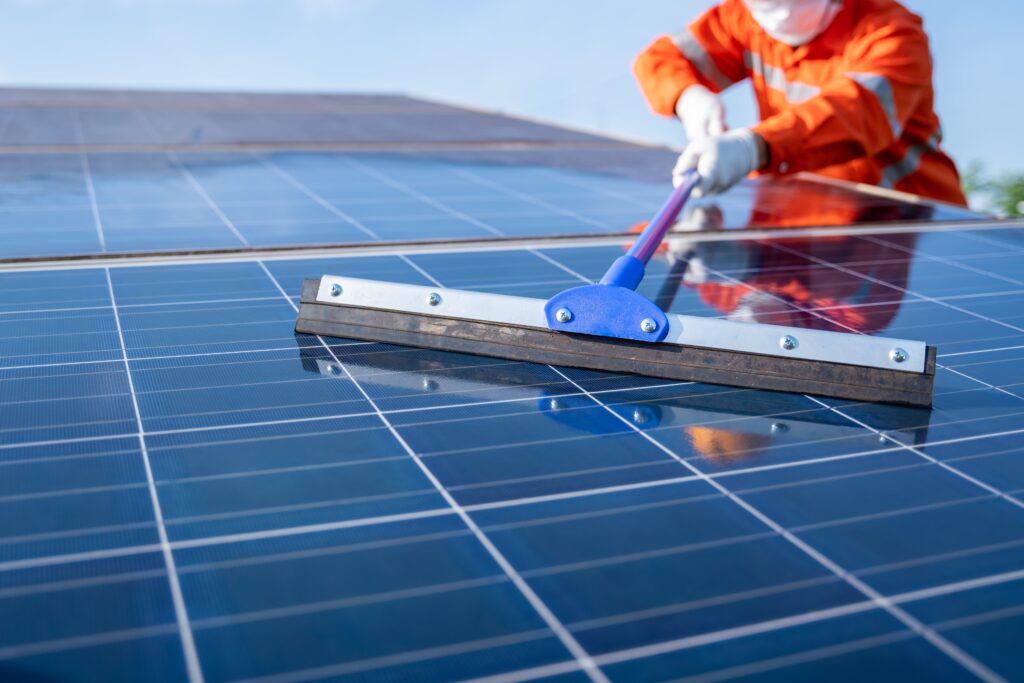 close-up-mop-loperation-team-use-mop-working-cleaning-solar-plant-good-performance-service-operation-plan-solar-panels-cleaning-concept-min