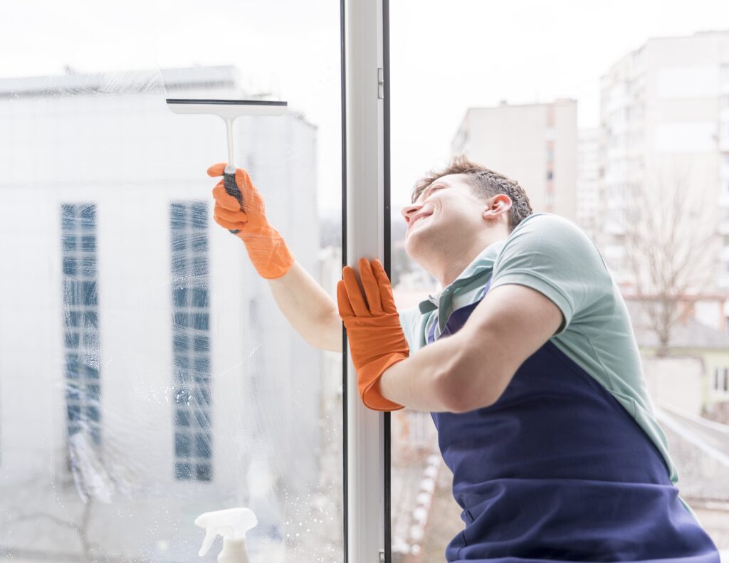 man-cleaning-windows-min